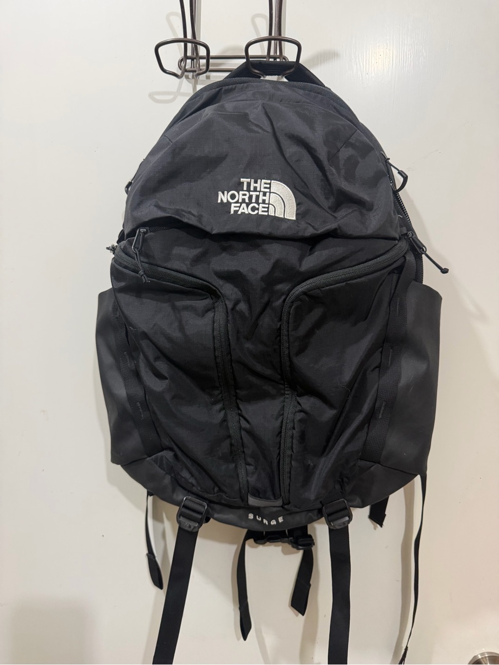 The North Face Surge Black Backpack with Multiple Front Pockets 31L
